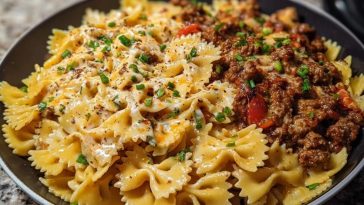 Cheesy Bowtie Pasta with Savory Cajun Ground Beef in Garlic Cream