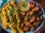 Chili Garlic Butter Chicken Bites with Creamy Cajun Corn Alfredo Twists