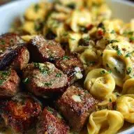 Garlic Butter Steak Bites with Creamy Parmesan Tortellini and Garlic Sauce