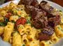 Rigatoni in Garlic Butter Parmesan Cream Sauce with Cajun Steak Tips