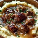 Creamy Roasted Garlic Mashed Potatoes with Savory Sausage Gravy