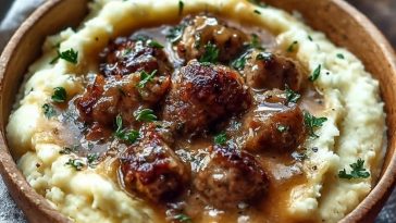 Creamy Roasted Garlic Mashed Potatoes with Savory Sausage Gravy