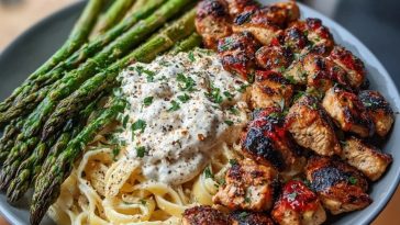 Delicious Greek Chili Chicken Alfredo with Smoked Feta Cream & Crispy Parmesan Asparagus