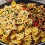 Cheesy Bowtie Pasta with Savory Cajun Ground Beef in Garlic Cream
