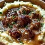 Creamy Roasted Garlic Mashed Potatoes with Savory Sausage Gravy