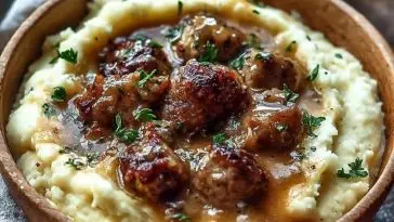 Creamy Roasted Garlic Mashed Potatoes with Savory Sausage Gravy
